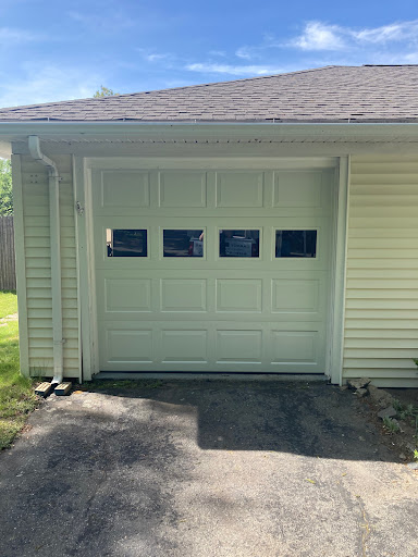 New Garage Door Installation in Framingham, MA: 9’0″ x 7’0″ General Door Model E64 MDO Plywood. Recessed Short Panel.